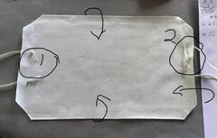 Image showing how to snip the four corners of the mask