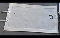 Image showing the mask, folded inwards to create the hem