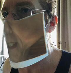 Image showing the hemmed mask final product, as worn on a face