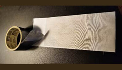 Image showing printed selfies being reinforced with duct tape